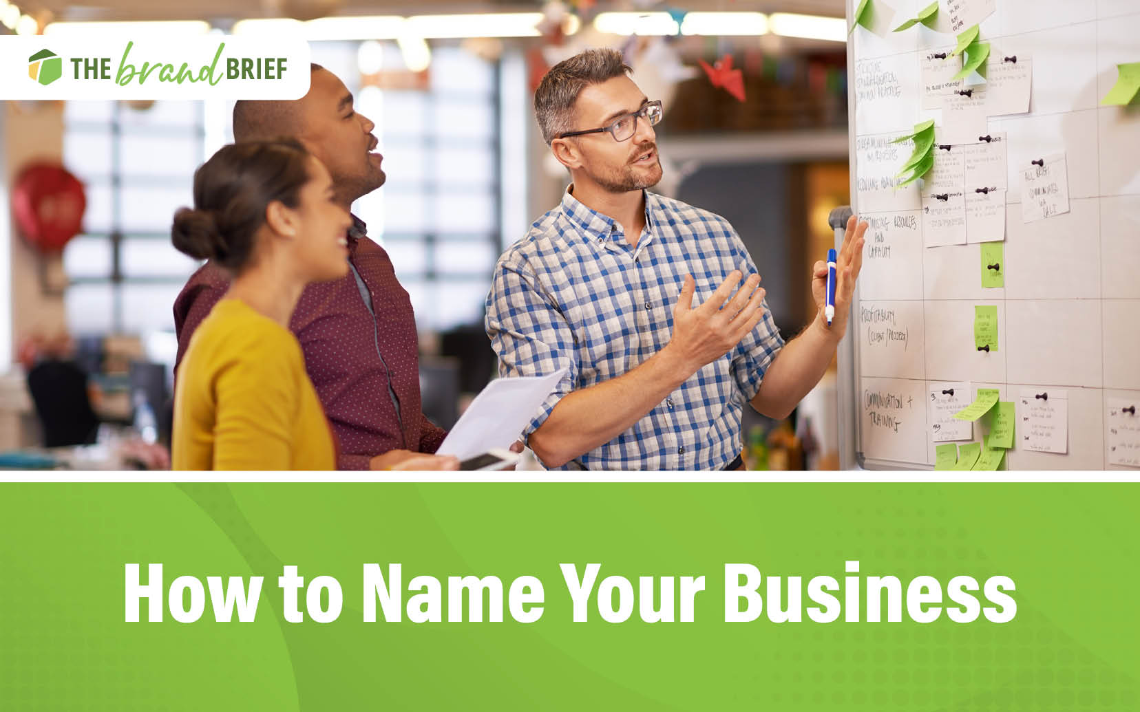 Naming Your Business A group of creative professionals brainstorming at a whiteboard to come up with the perfect business name